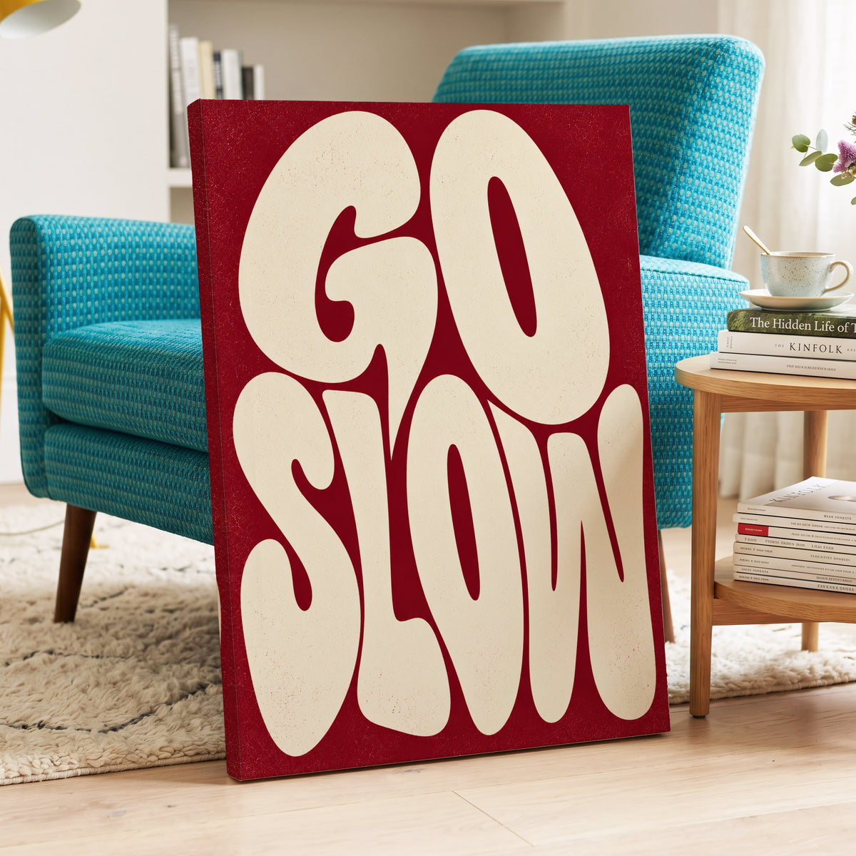 Go Slow Ruby, red, beige abstract wall art on canvas displayed in a styled interior, gallery view 2