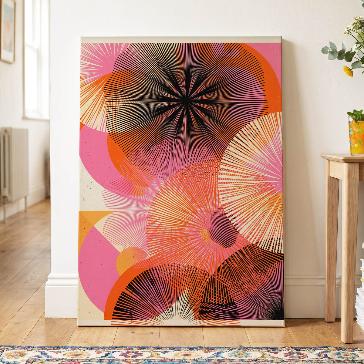Radiant Orbit, pink, orange, black abstract wall art on canvas displayed in a styled interior, gallery view 2