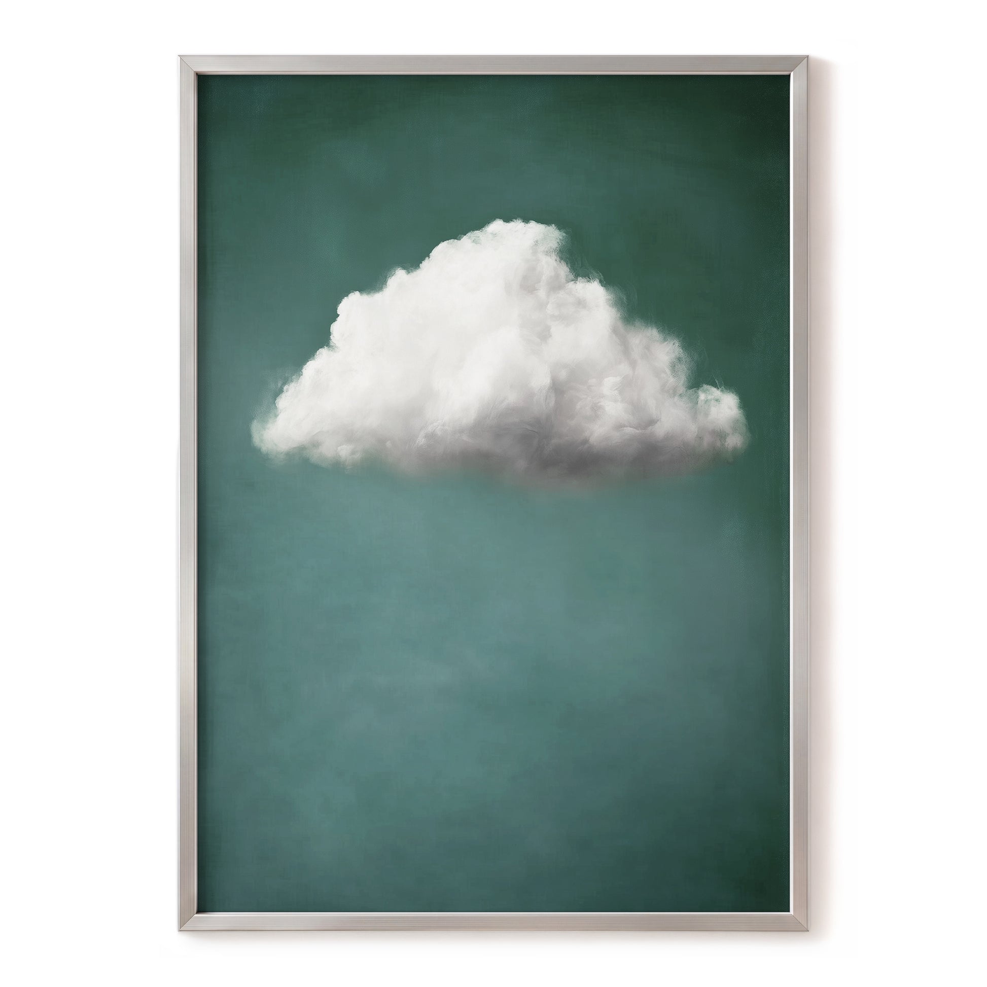 A framed art print featuring a single fluffy white cloud against a textured teal-green background, enclosed in a thin silver frame.