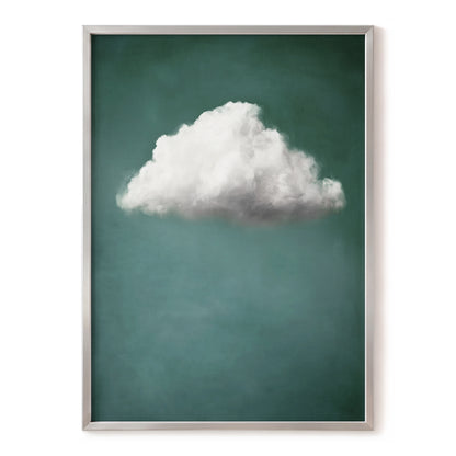 A framed art print featuring a single fluffy white cloud against a textured teal-green background, enclosed in a thin silver frame.