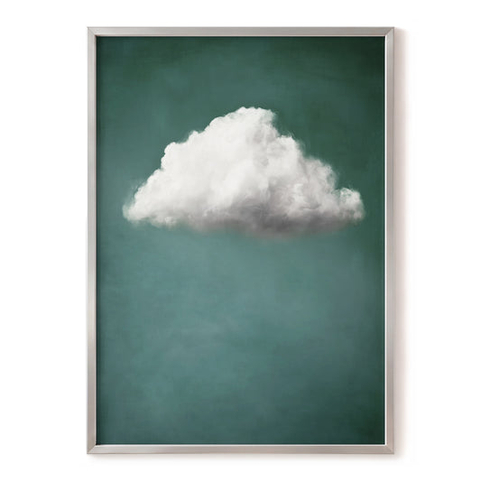 A framed art print featuring a single fluffy white cloud against a textured teal-green background, enclosed in a thin silver frame.