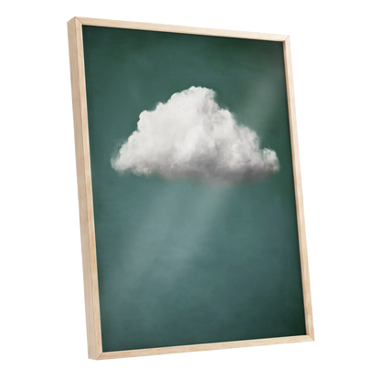 A framed wall art print featuring a single white cloud against a dark teal-green background with soft light rays, shown in a light natural wood frame on a white background.