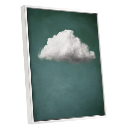 A framed wall art print featuring a single fluffy white cloud against a deep teal-green background, shown at an angle with a white floating frame on a light gray studio background.