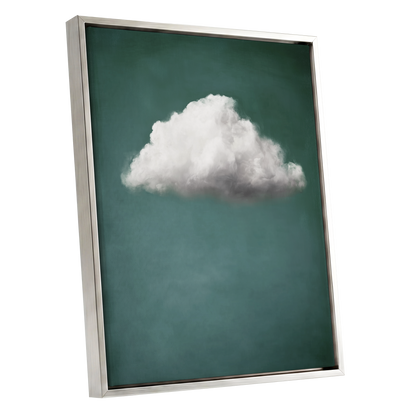 A framed wall art print featuring a single white cloud against a deep teal background, shown at an angle with a silver frame on a white background.
