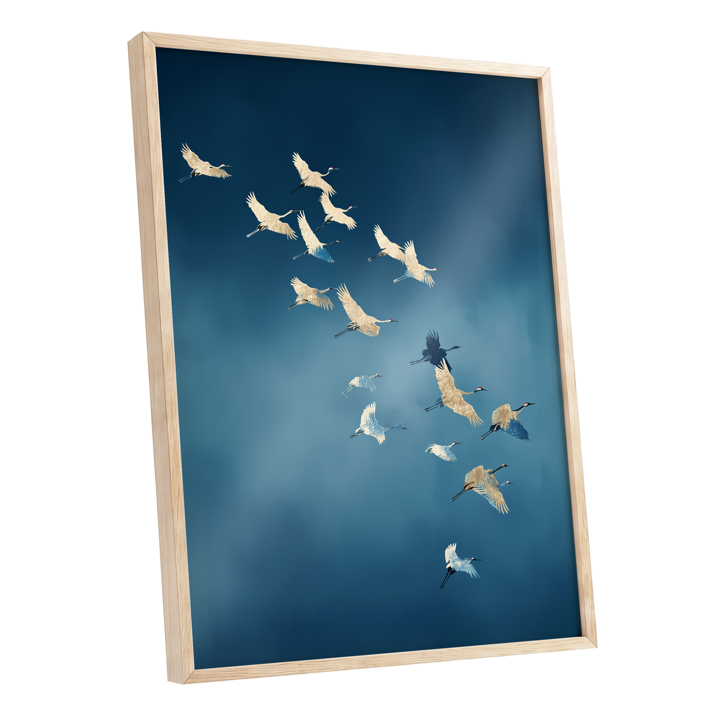 Framed wall art featuring a flock of cranes flying across a deep blue sky, shown in a light natural wood frame against a white background.