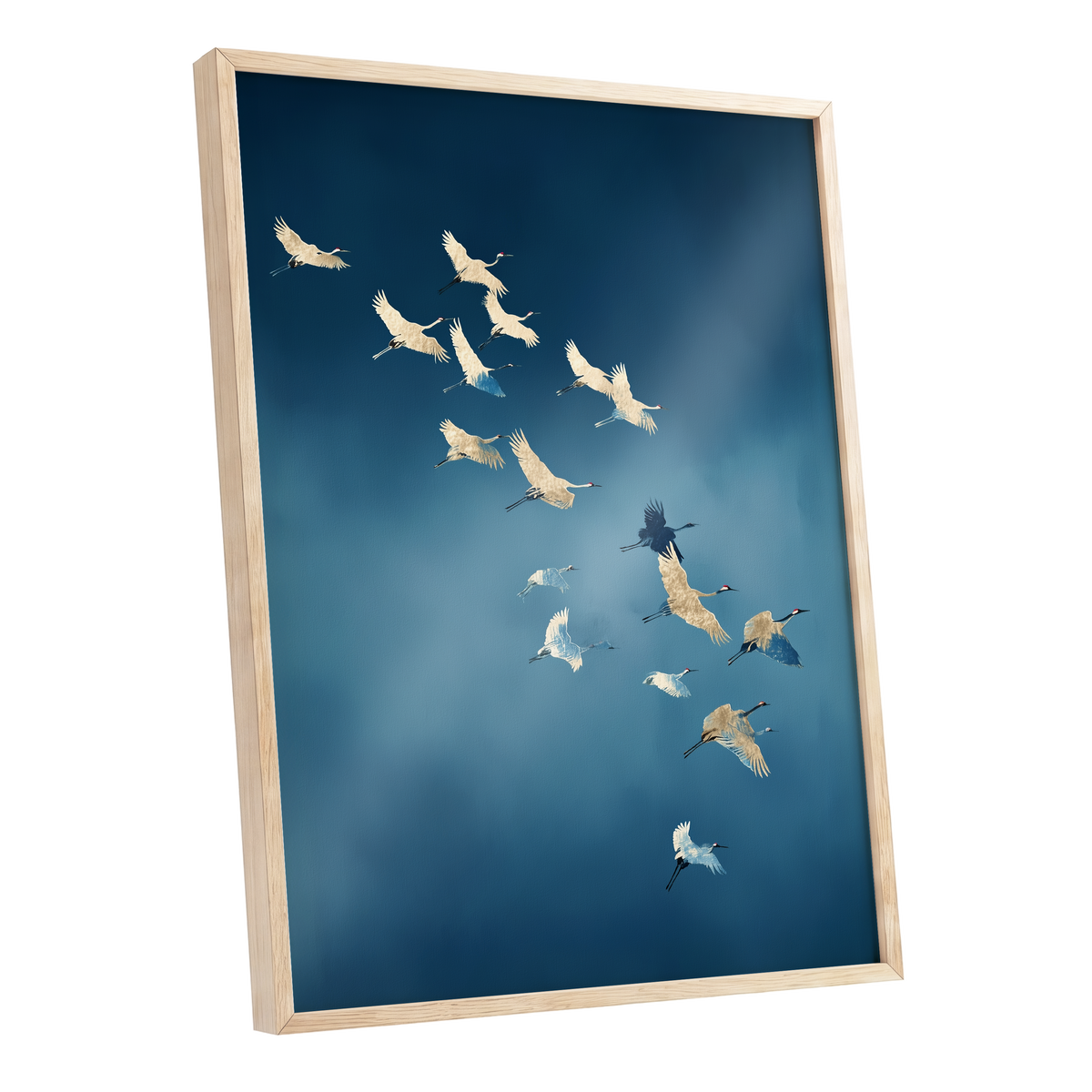 Framed wall art featuring a flock of cranes flying across a deep blue sky, shown in a light natural wood frame against a white background.
