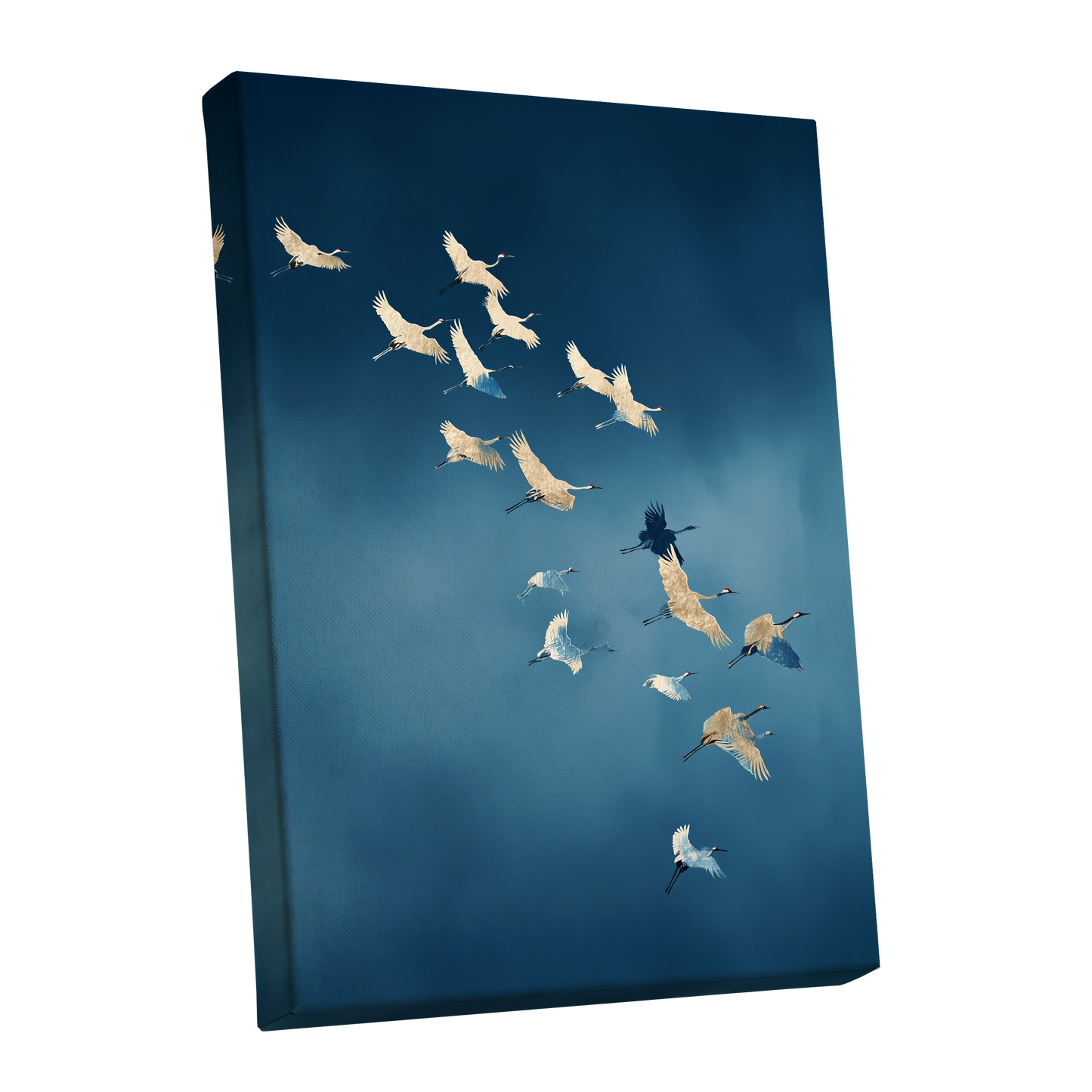 A vertical canvas wall art print showing a flock of cranes flying across a deep blue sky, photographed at an angle against a plain white background.