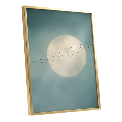 Framed wall art featuring a large pale moon and a flock of birds against a muted blue-green sky, shown in a thin gold frame on a white background.