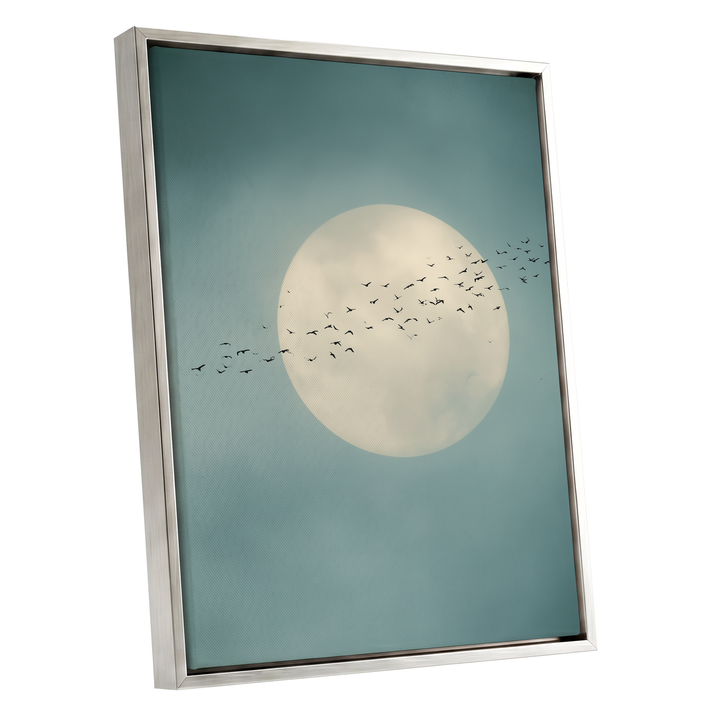 A framed art print featuring a large cream-colored full moon and a flock of birds against a muted teal-blue sky, housed in a modern silver frame.