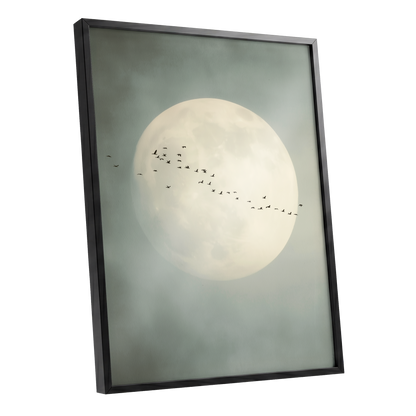 Framed wall art featuring a large pale full moon in a misty gray-green sky, with a small flock of birds across the center, shown in a black frame on a white background.