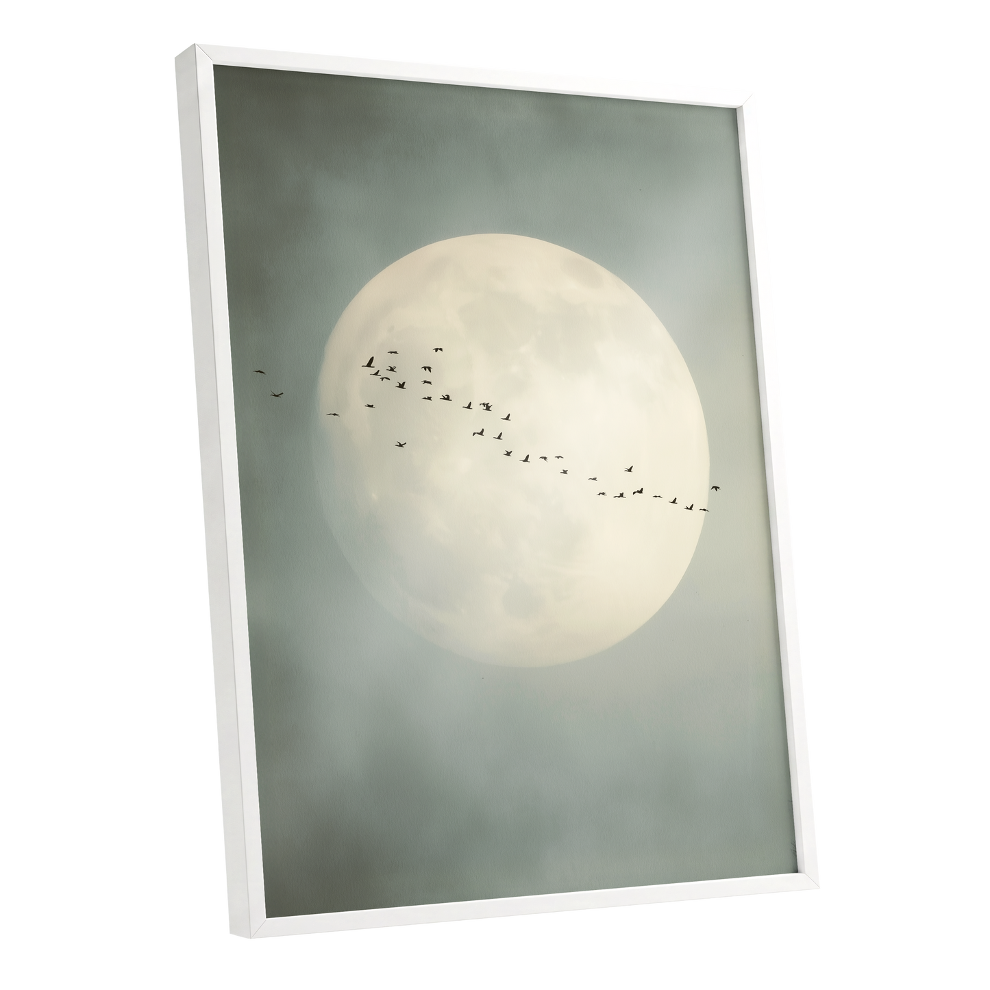 Framed wall art featuring a large pale full moon in a misty gray-green sky, with a line of small birds flying across the center. The frame is white and shown at a slight angle on a plain white background.