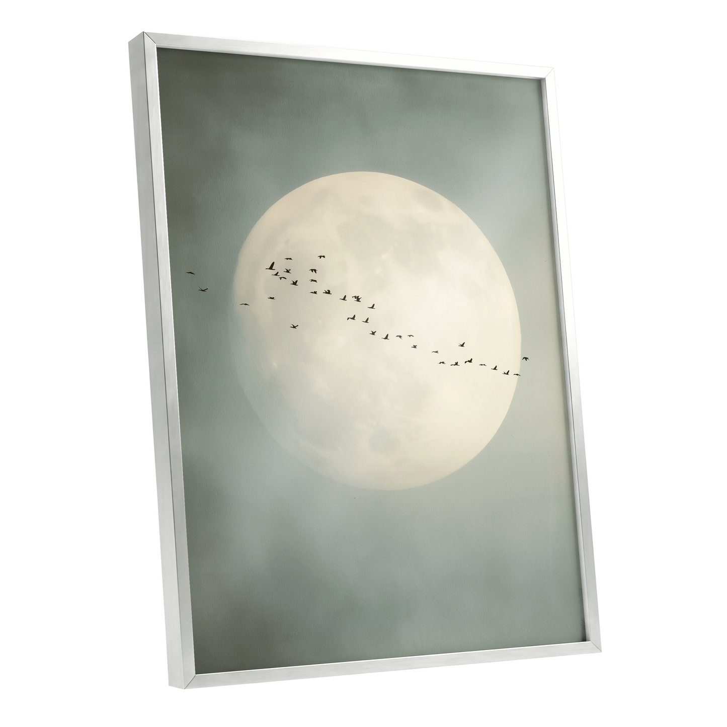Framed wall art featuring a large pale full moon in a misty gray-green sky, with a line of small birds flying across the center, shown in a white frame against a light gray background.