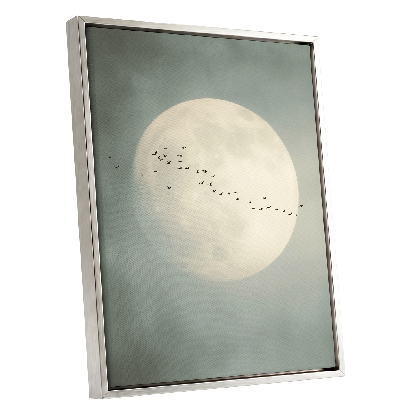 Framed wall art featuring a large pale moon in a misty gray-blue sky with a small flock of birds flying across it, shown in a gold frame on a white background.