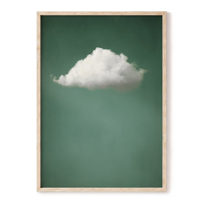 Framed wall art featuring a single white cloud against a muted green background, enclosed in a light natural wood frame and shown against a white wall.
