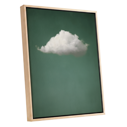 Framed wall art featuring a single white cloud centered on a muted green background, shown in a light wood frame against a plain white backdrop.