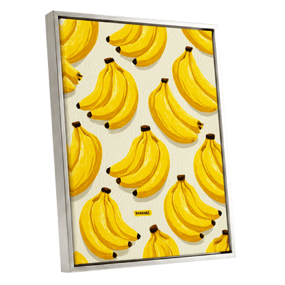 Banana Bunch Parade, yellow, beige, brown nature wall art shown as a silver framed canvas wall art