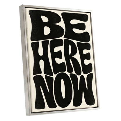 Be Here Now, black, beige minimalist wall art shown as a silver framed canvas wall art