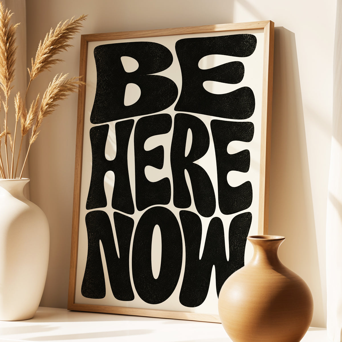 Be Here Now, black, beige minimalist wall art displayed in a styled interior, gallery view 3