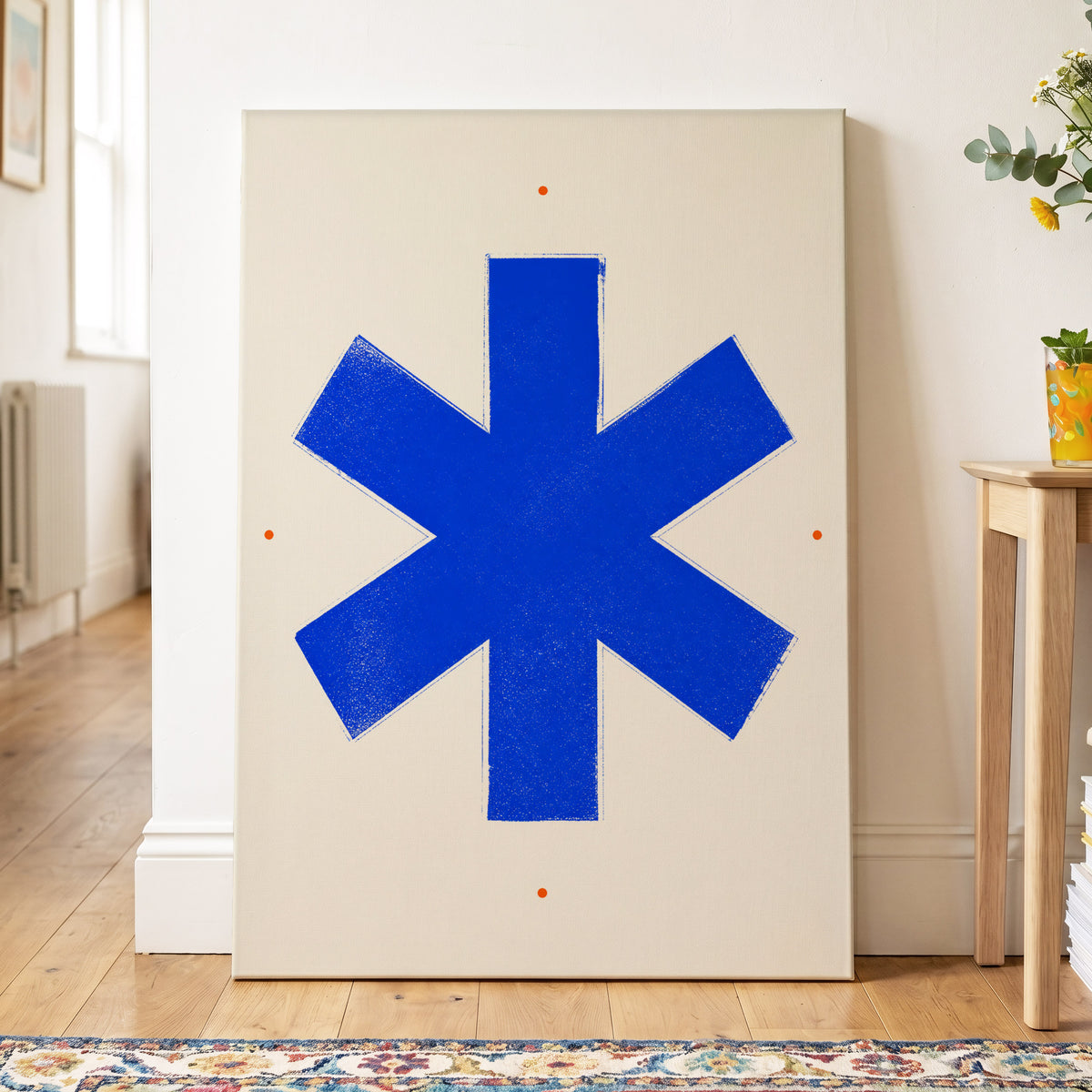 Blue Asterisk Orbit, blue, beige, orange minimalist wall art on canvas displayed in a styled interior, gallery view 2