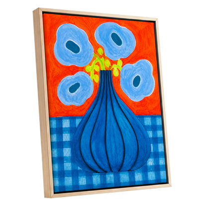 Blue Bloom Carnival, blue, orange, green floral wall art shown as a oak framed canvas wall art