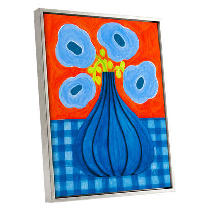 Blue Bloom Carnival, blue, orange, green floral wall art shown as a silver framed canvas wall art