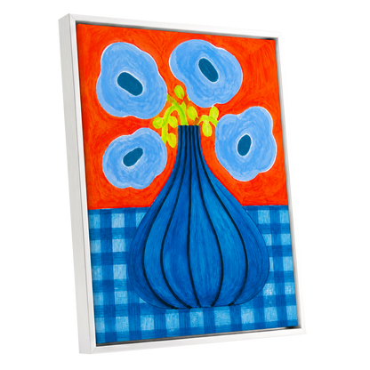 Blue Bloom Carnival, blue, orange, green floral wall art shown as a white framed canvas wall art