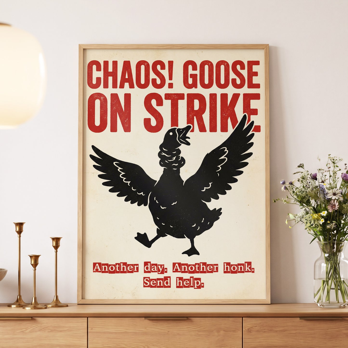 Chaos Goose on Strike, black, beige, red nature wall art displayed in a styled interior, gallery view 5