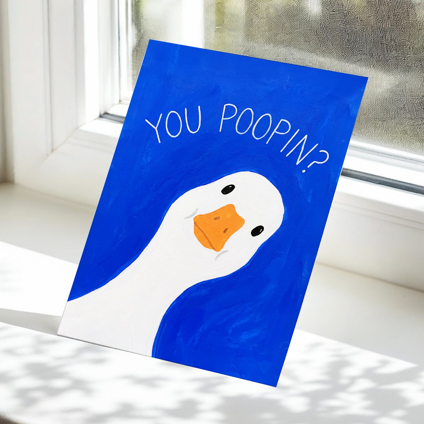 Cheeky Goose Check-In, blue, white, orange nature wall art displayed in a styled interior, gallery view 5
