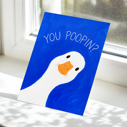 Cheeky Goose Check-In, blue, white, orange nature wall art displayed in a styled interior, gallery view 5