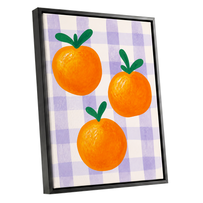 Citrus on Lilac, orange, green, purple nature wall art shown as a black framed canvas wall art