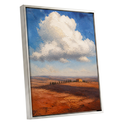 Cloud Over Ochre Fields, blue, white, brown nature wall art shown as a silver framed canvas wall art