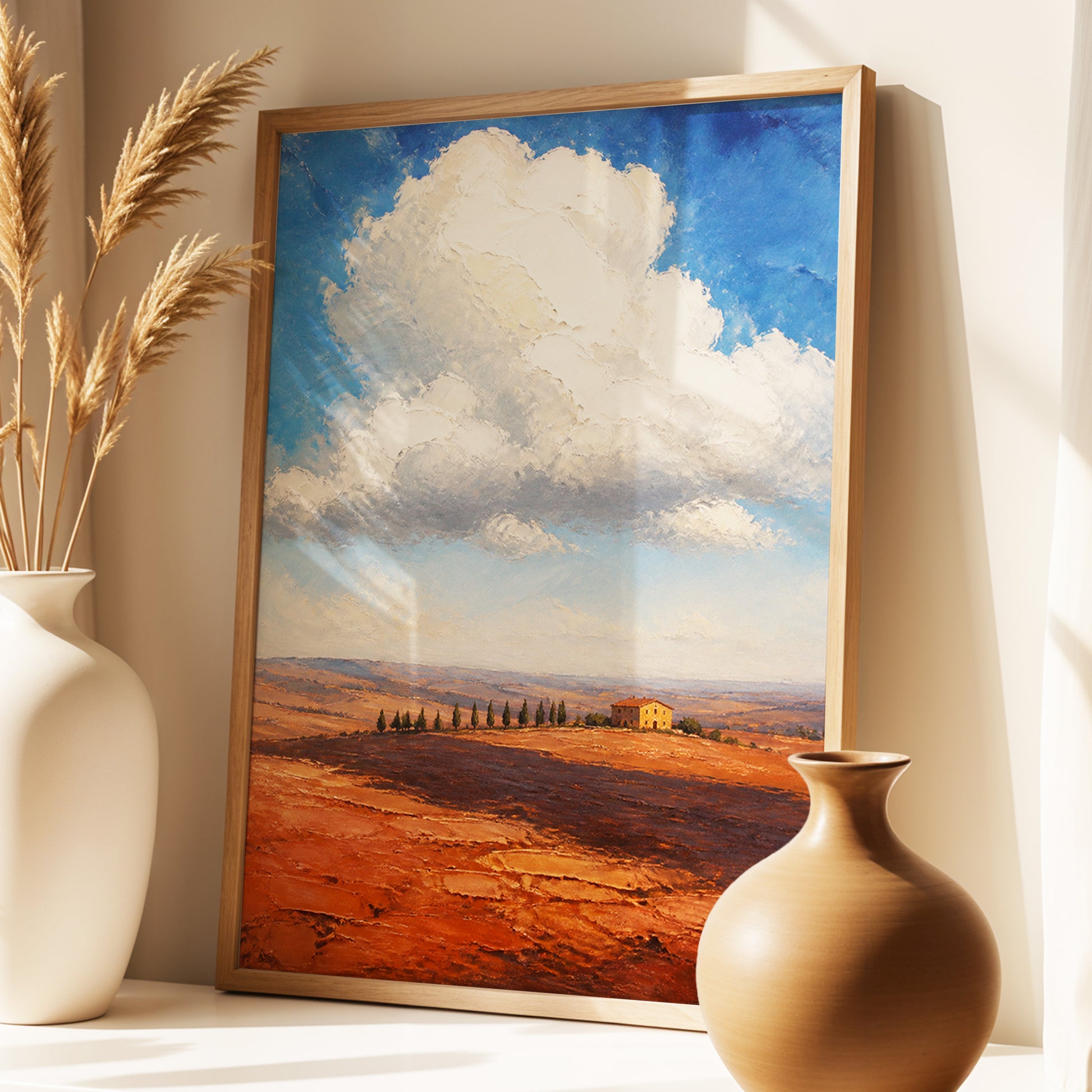 Cloud Over Ochre Fields, blue, white, brown nature wall art displayed in a styled interior, gallery view 3