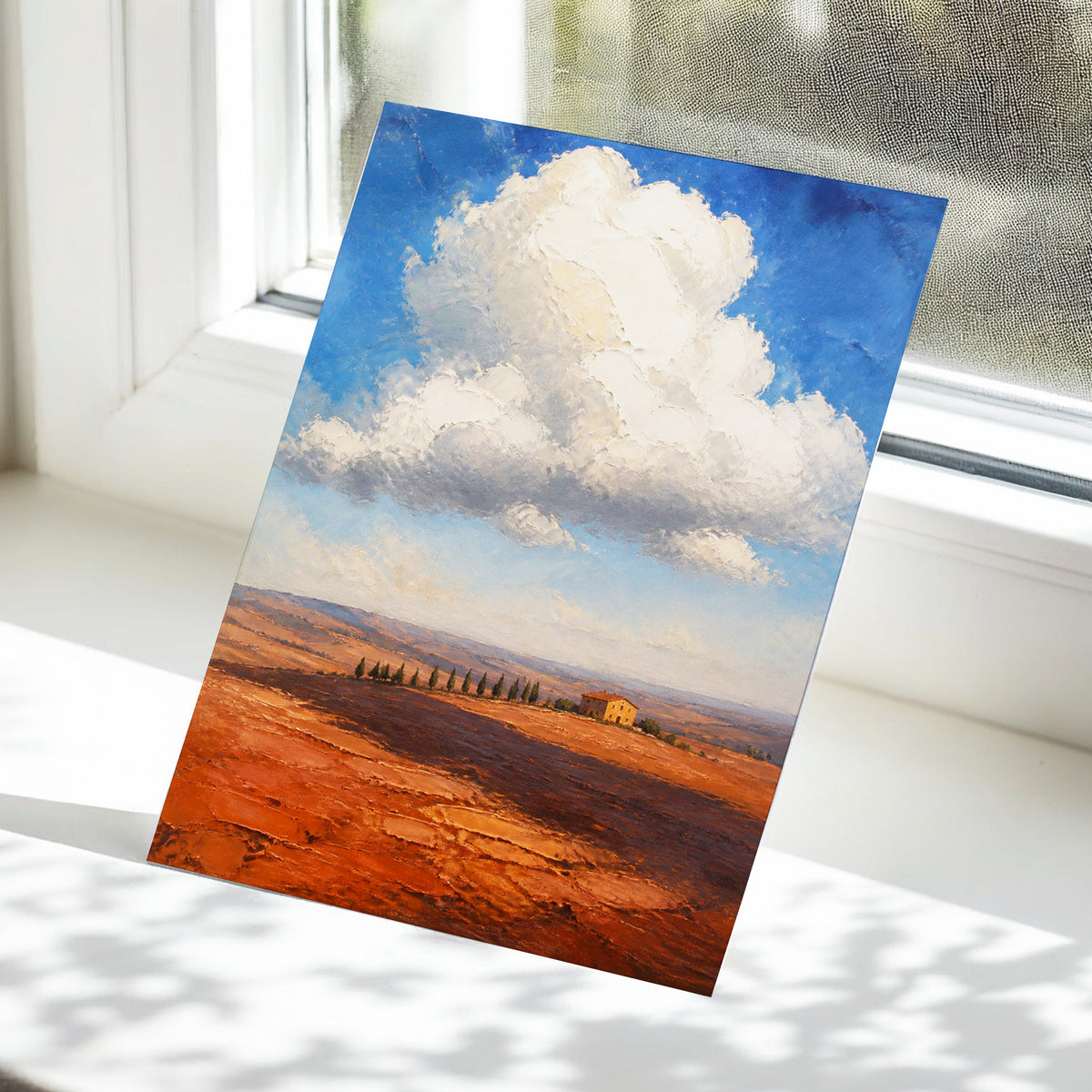 Cloud Over Ochre Fields, blue, white, brown nature wall art displayed in a styled interior, gallery view 5