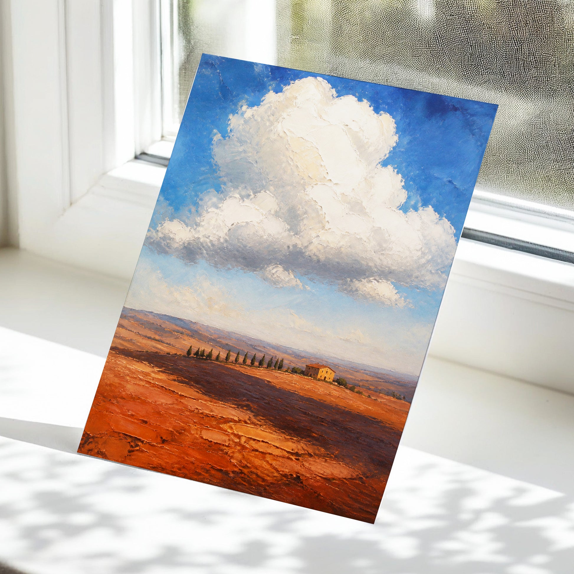 Cloud Over Ochre Fields, blue, white, brown nature wall art displayed in a styled interior, gallery view 5