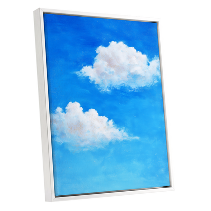 Clouds in Cobalt, blue, white, beige nature wall art shown as a white framed canvas wall art