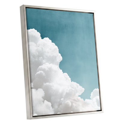 Clouds in Quiet Blue, blue, white, gray nature wall art shown as a silver framed canvas wall art