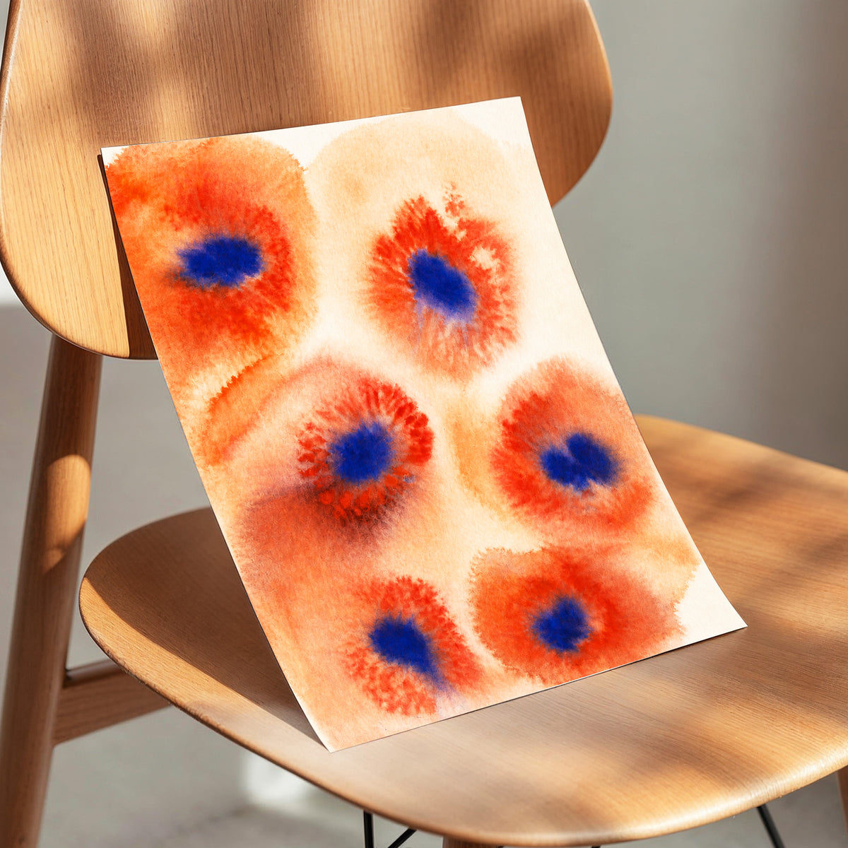 Cobalt Bloom Drift, orange, red, blue floral wall art displayed in a styled interior, gallery view 5