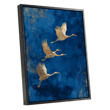 Cranes Across Cobalt, blue, gold, brown nature wall art shown as a black framed canvas wall art