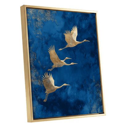 Cranes Across Cobalt, blue, gold, brown nature wall art shown as a gold framed canvas wall art