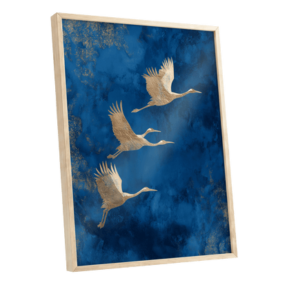 Cranes Across Cobalt, blue, gold, brown nature wall art shown as a oak framed poster wall art print