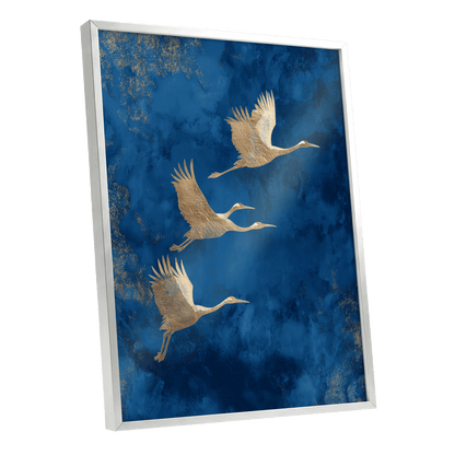 Cranes Across Cobalt, blue, gold, brown nature wall art shown as a silver framed poster wall art print