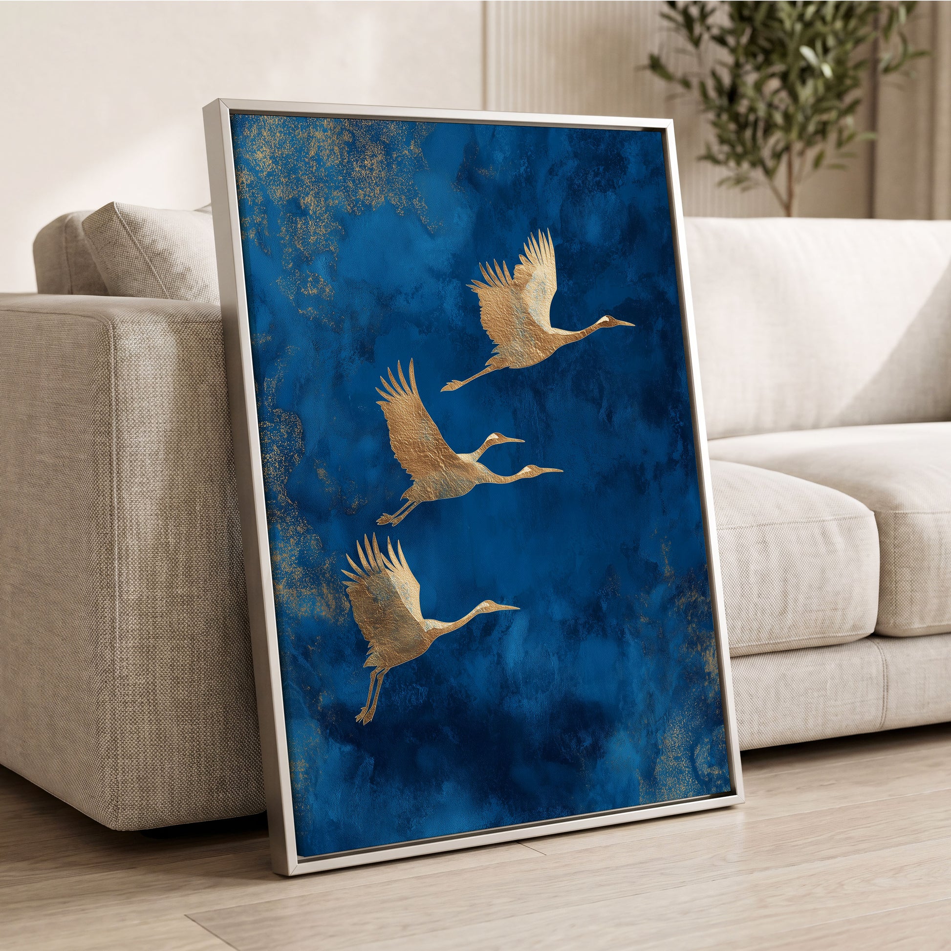 Cranes Across Cobalt, blue, gold, brown nature wall art displayed in a styled interior, gallery view 2