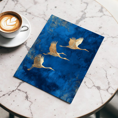 Cranes Across Cobalt, blue, gold, brown nature wall art displayed in a styled interior, gallery view 3