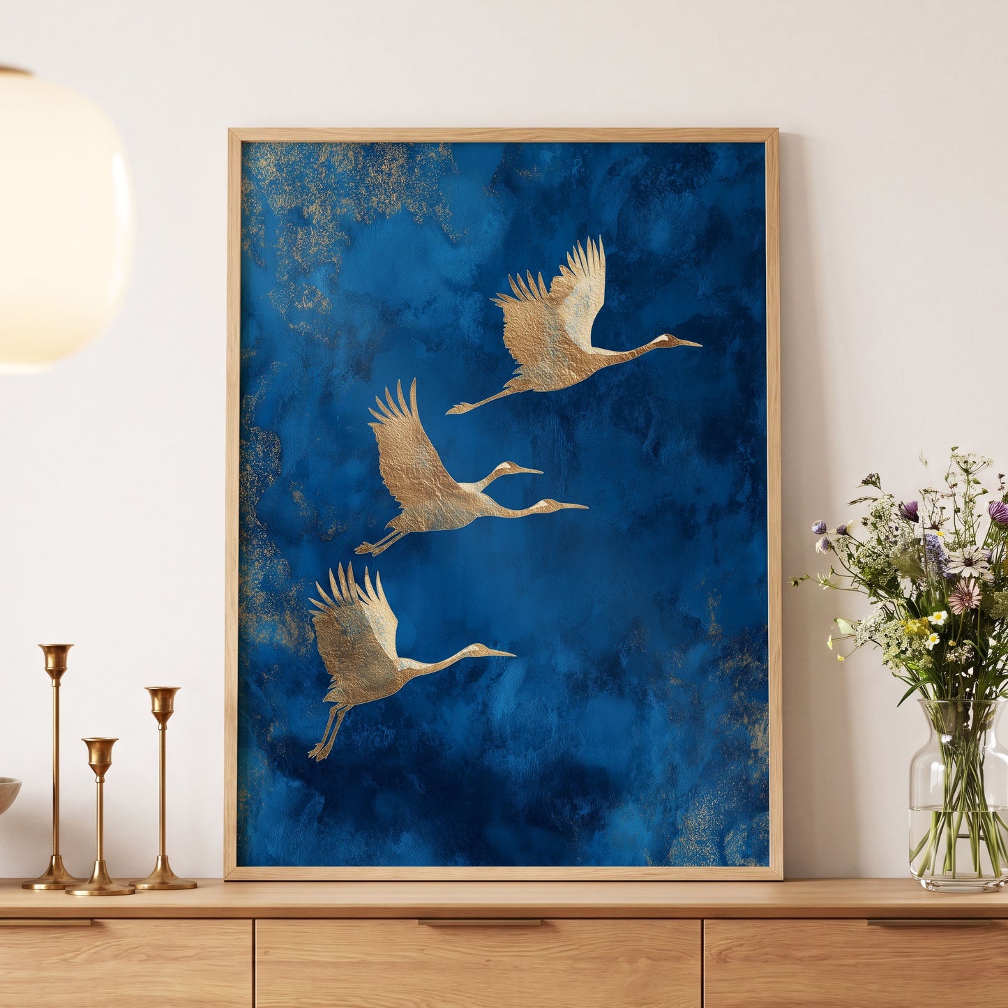 Cranes Across Cobalt, blue, gold, brown nature wall art displayed in a styled interior, gallery view 5