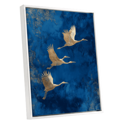 Cranes Across Cobalt, blue, gold, brown nature wall art shown as a white framed canvas wall art