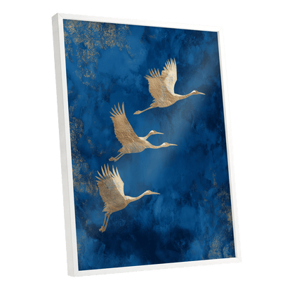 Cranes Across Cobalt, blue, gold, brown nature wall art shown as a white framed poster wall art print