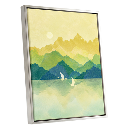 Cranes at Golden Daybreak, yellow, gold, green nature wall art shown as a silver framed canvas wall art
