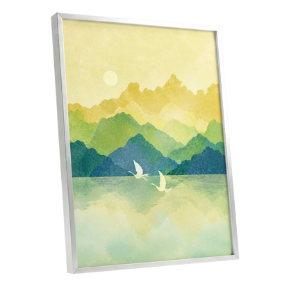Cranes at Golden Daybreak, yellow, gold, green nature wall art shown as a silver framed poster wall art print