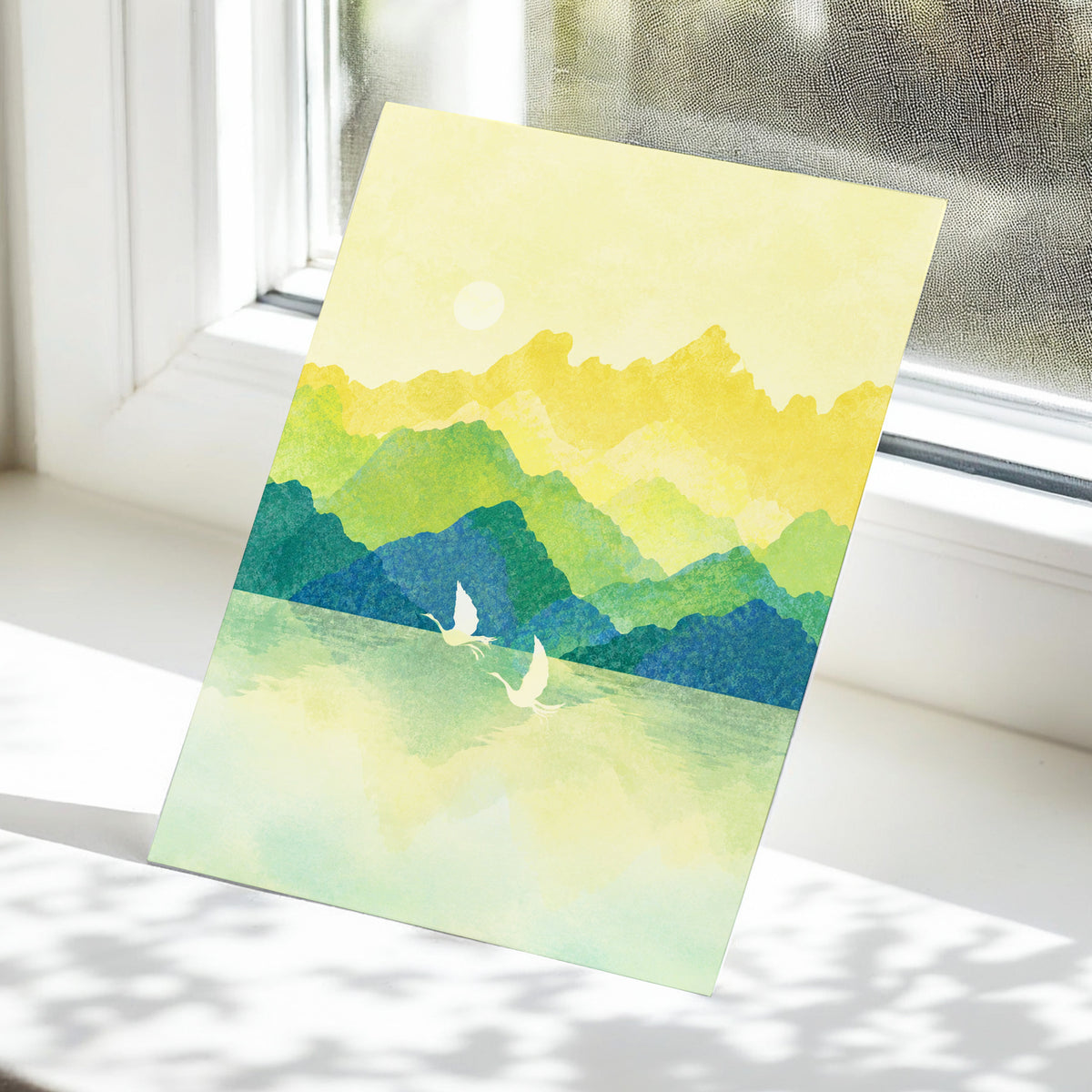 Cranes at Golden Daybreak, yellow, gold, green nature wall art displayed in a styled interior, gallery view 5