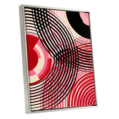 Crimson Orbit, black, pink, red abstract wall art shown as a silver framed canvas wall art